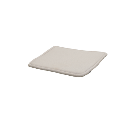 Sand cushion with a soft, curved design and no visible patterns.