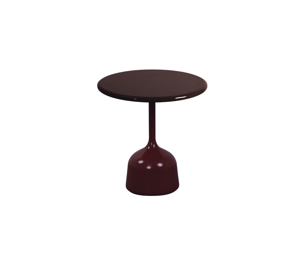 Burgundy table with a round top and a rounded base in a modern design.