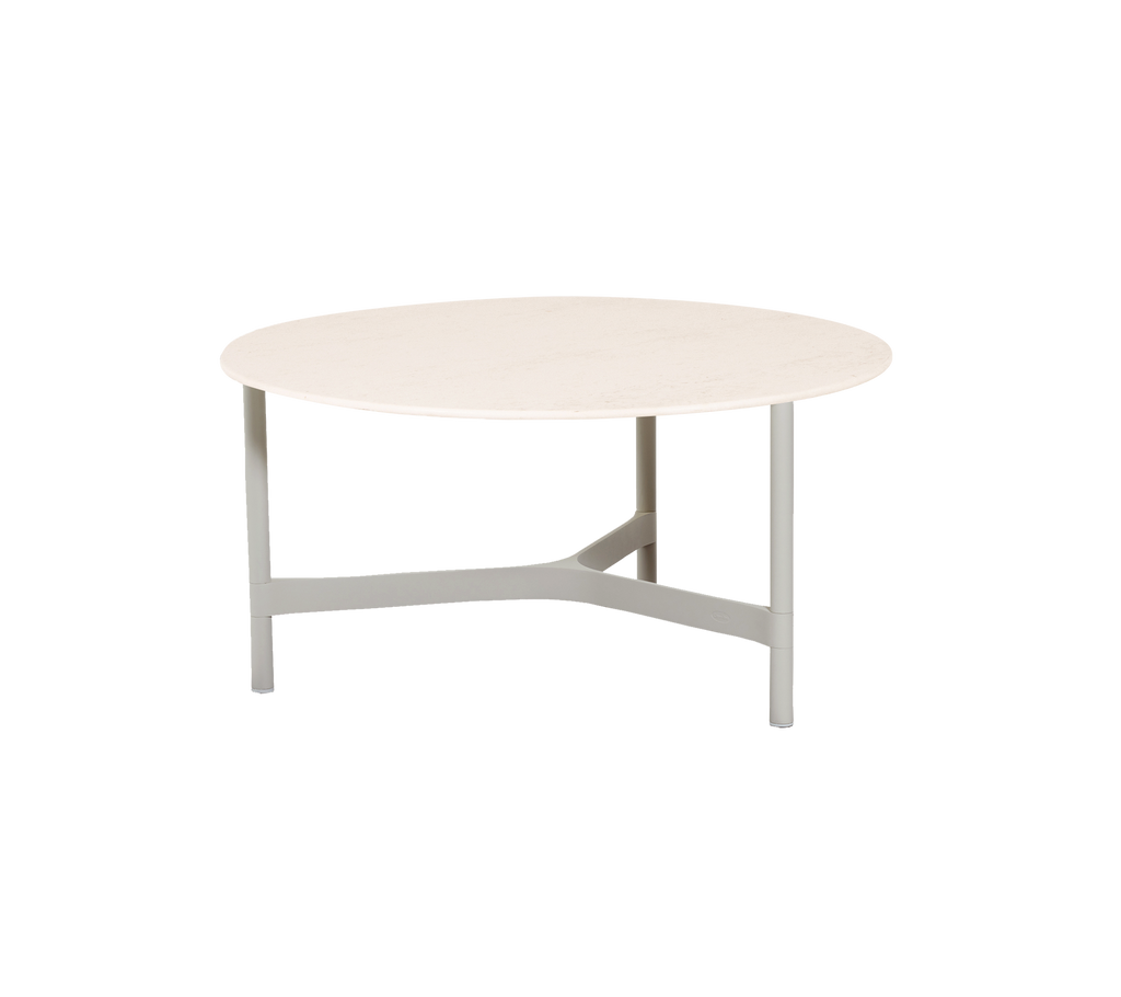 Round table with a smooth top and a sturdy, minimalist base, designed for versatile use in various settings.