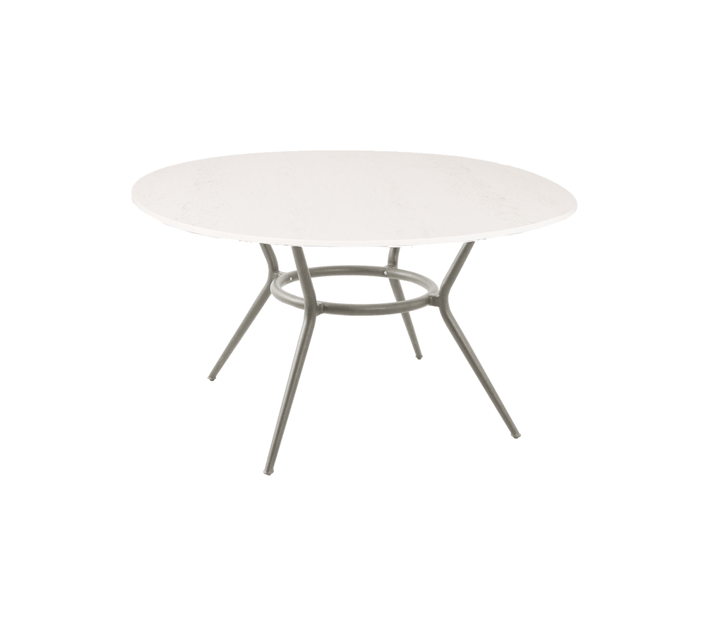 Round table with a simple design and light-colored surface.
