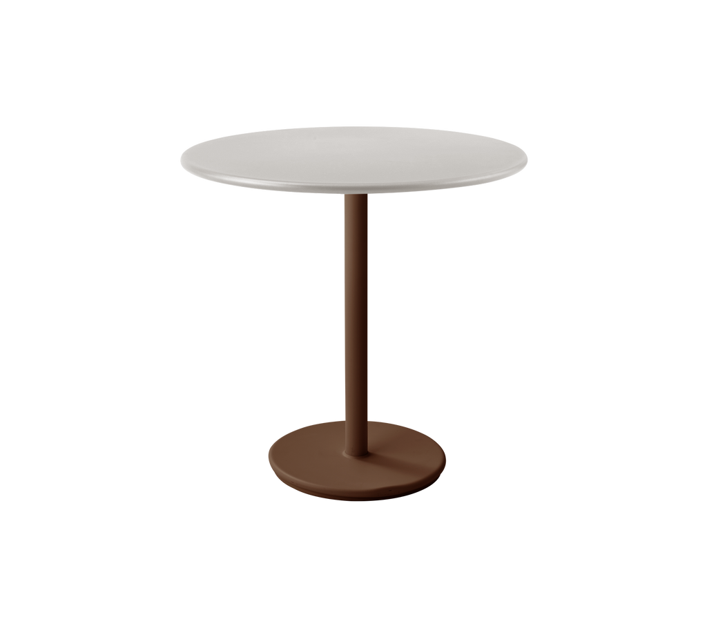 Modern round table with a white top and desert red base.