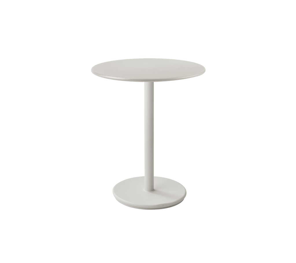 Modern white table with circular top and slender base.
