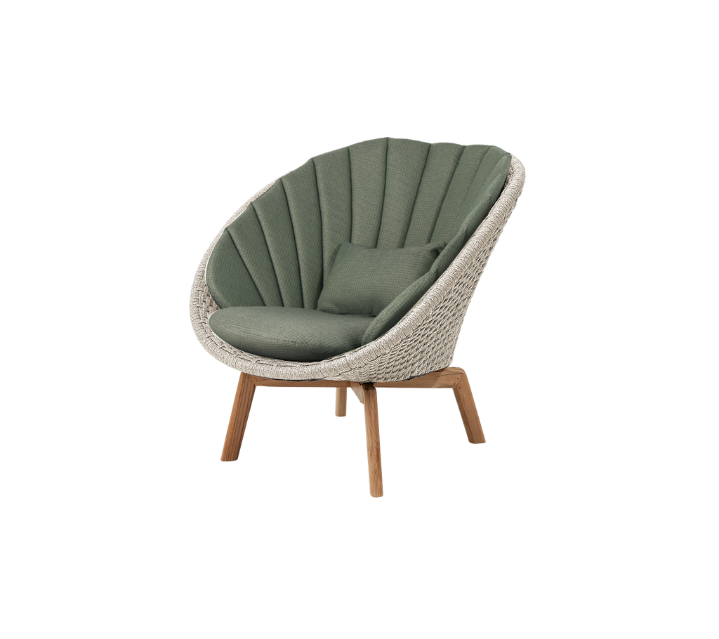 Modern green lounge chair with a unique design.