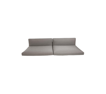 Light grey modular sofa divided into two sections, featuring a minimalist design with clean lines and a contemporary aesthetic.