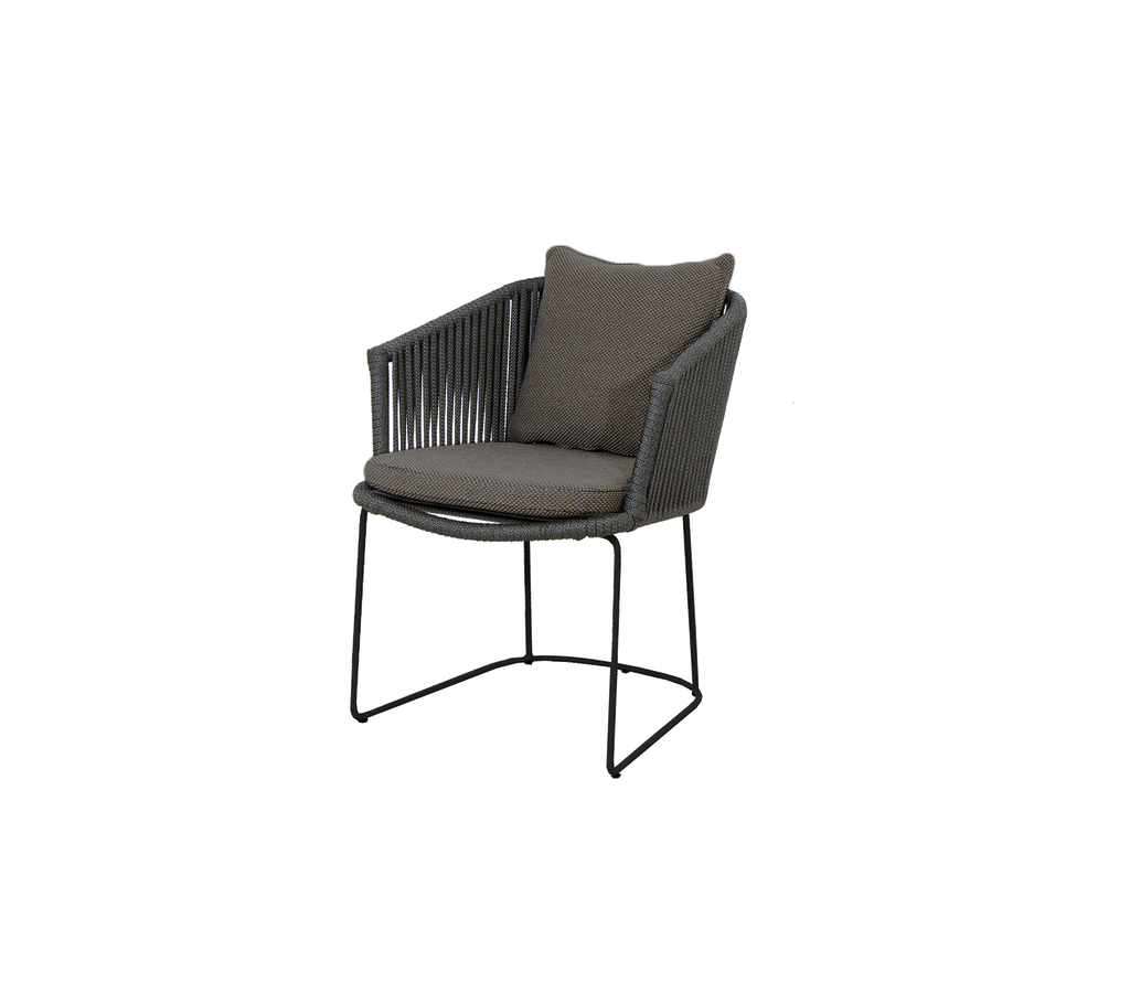 Stylish modern chair with a curved frame, padded seat, and soft backrest, perfect for indoor or outdoor use.