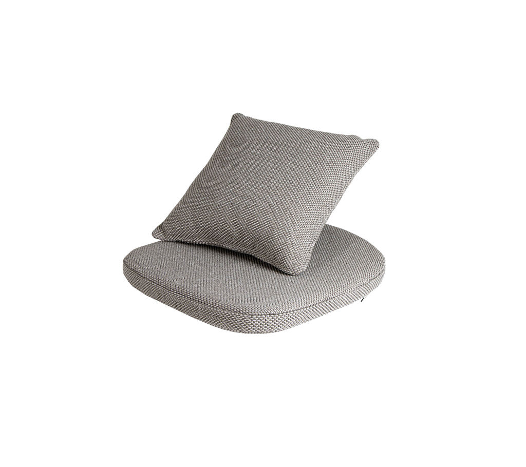 Gray cushioned seating with a round base and a square back pillow, designed for comfort and modern decor.