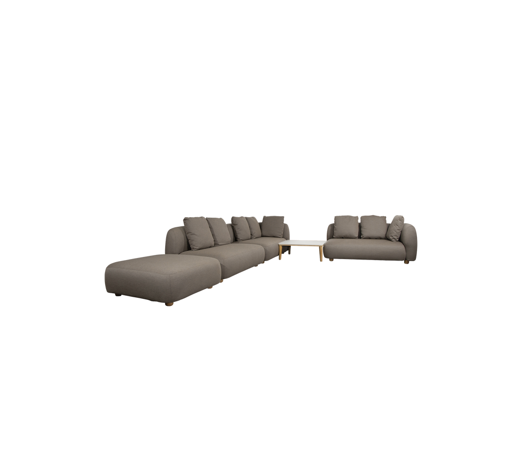 Modern taupe sectional sofa and loveseat in a stylish lounge setting.