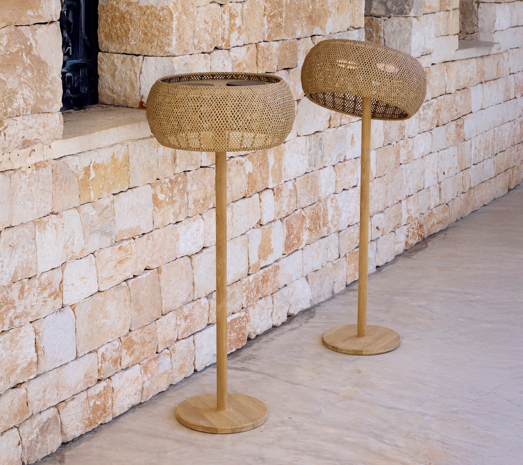 Two modern brown floor lamps with a distinct woven design.