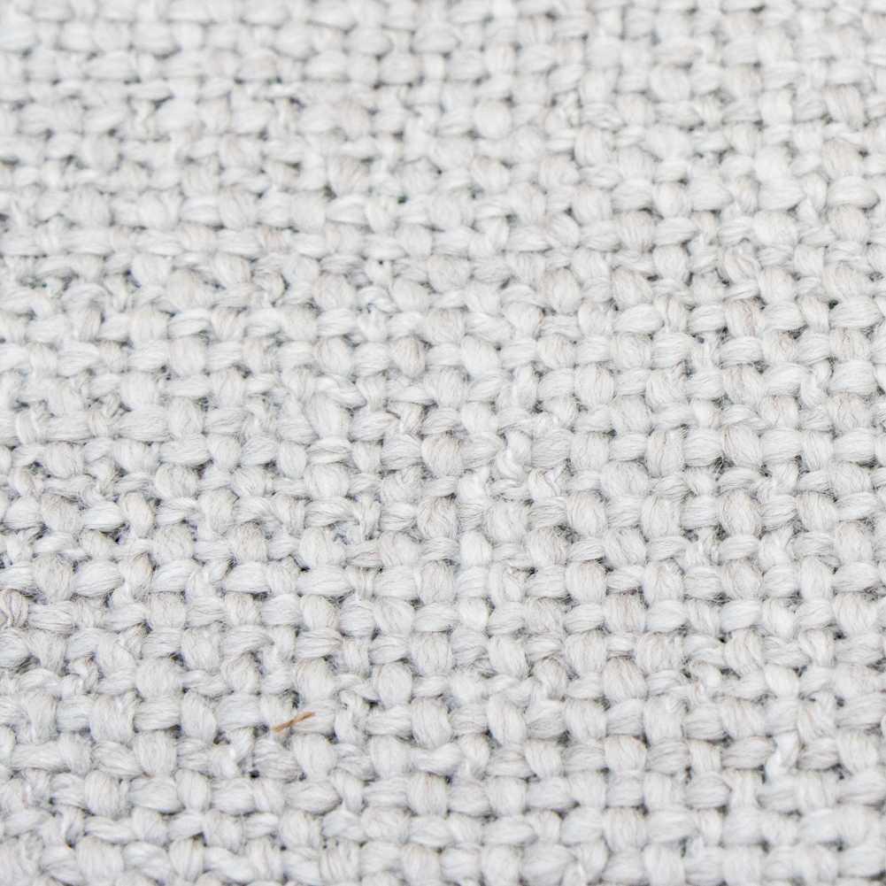Textured grey fabric with a woven appearance.