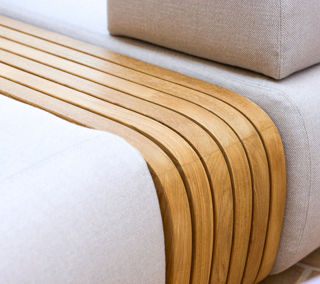 Mellow sofa featuring smooth, wooden accents and a cozy texture, complemented by a matching coffee table.